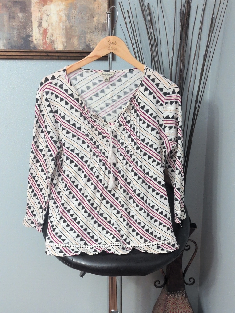 Lucky Brand White V‑Neck Tassel Blouse with Pink & Black Geometric Stripes
